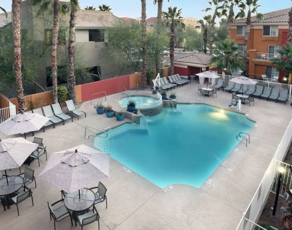 Relaxing outdoor pool with pool chairs at Holiday Inn Express & Suites Scottsdale - Old Town.
