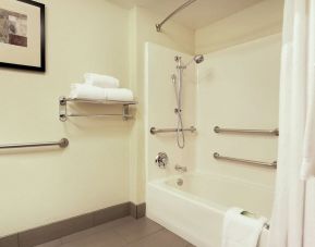 Guest bathroom with bath and shower at Holiday Inn Express & Suites Scottsdale - Old Town.