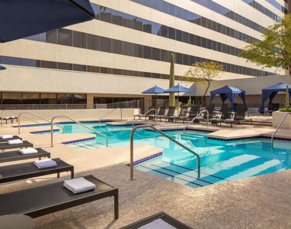 Lovely outdoor pool with pool chairs at Hyatt Regency Phoenix.