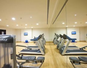 Equipped fitness center at Millennium Central Doha.