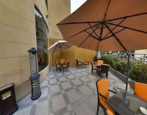 Outdoor terrace and coworking space at Millennium Central Doha.