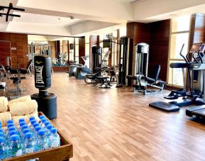 Equipped fitness center at Millennium Hotel Doha.