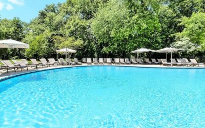 Luxurious outdoor pool with pool chairs at Hilton Short Hills.