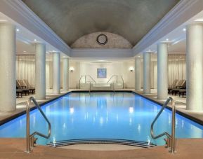 Stunning indoor pool with pool chairs at Hilton Short Hills.