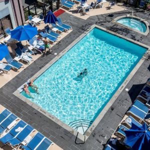 Relaxing pool area with pool chairs at Hilton Whistler Resort & Spa.