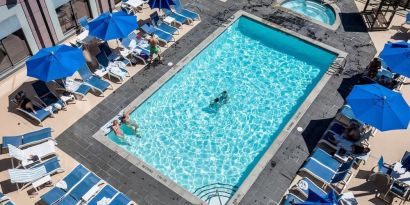 Relaxing pool area with pool chairs at Hilton Whistler Resort & Spa.