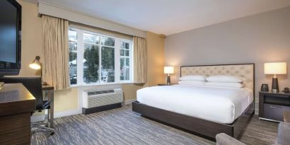 King room with TV at Hilton Whistler Resort & Spa.