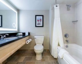 Guest bathroom with shower and bath at Hilton Whistler Resort & Spa.