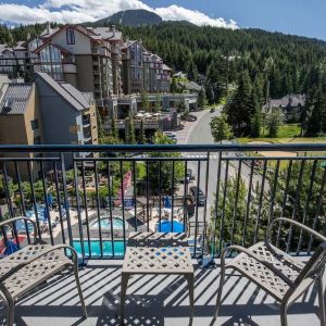 Day rooms with balcony and seating area at Hilton Whistler Resort & Spa.