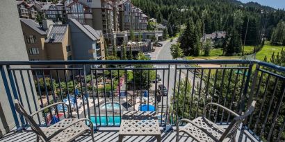 Day rooms with balcony and seating area at Hilton Whistler Resort & Spa.