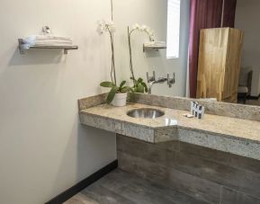 Guest bathroom with shower at Catalina Hotel & Beach Club.