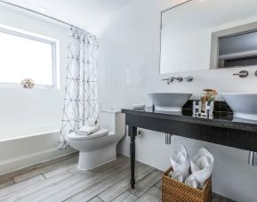 Private guest bathroom at Seaside All Suites Hotel.