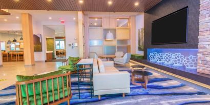 Lobby and coworking lounge at Fairfield Inn & Suites By Marriott Houston League City.