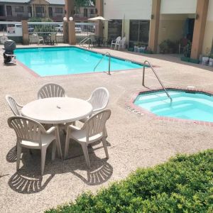 Refreshing outdoor pool at Coratel Inn & Suites By Jasper New Braunfels IH-35 EXT 189.