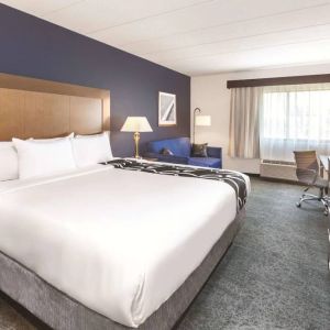 Day use room with work desk and sofa at La Quinta Inn & Suites By Wyndham Philadelphia Airport.

