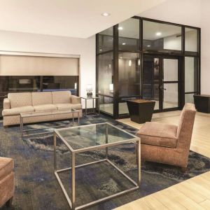 Lobby and coworking lounge at La Quinta Inn & Suites By Wyndham Philadelphia Airport.