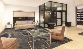 Lobby and coworking lounge at La Quinta Inn & Suites By Wyndham Philadelphia Airport.
