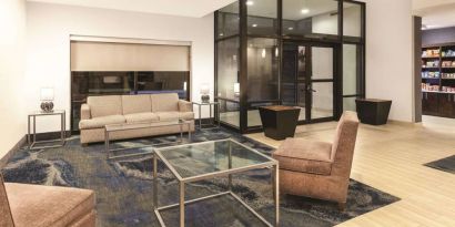 Lobby and coworking lounge at La Quinta Inn & Suites By Wyndham Philadelphia Airport.