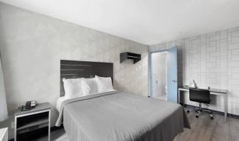 Day use room with work desk and natural light at Hotel 365 Bronx.