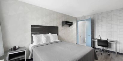 Day use room with work desk and natural light at Hotel 365 Bronx.