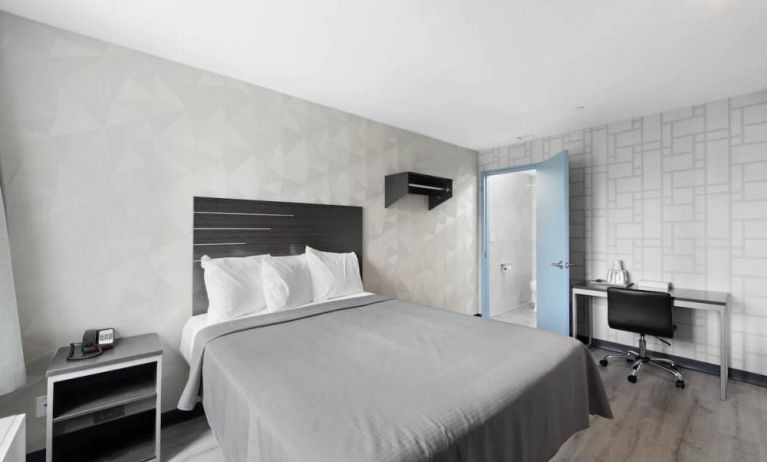 Day use room with work desk and natural light at Hotel 365 Bronx.