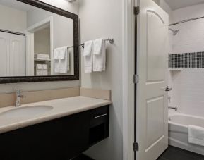 Private guest bathroom with shower and bath combo at Staybridge Suites Washington D.C.- Greenbelt.