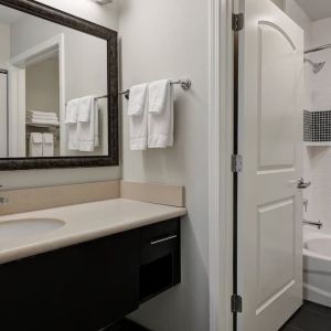 Private guest bathroom with shower and bath combo at Staybridge Suites Washington D.C.- Greenbelt.