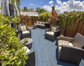 Comfortable outdoor meeting space at Hollywood Beach Suites, A South Beach Group Hotel.