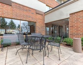 Outdoor terrace with seating at Holiday Inn Express Chicago - Downers Grove.