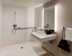 Guest bathroom with shower at Sleep Inn Oakbrook Terrace.