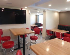 Dining and coworking space at Red Roof Plus Bourbonnais.