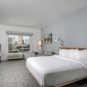 Day use room with work desk and sofa at TownePlace Suites Nashville Midtown.