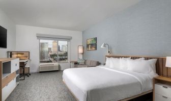 Day use room with work desk and sofa at TownePlace Suites Nashville Midtown.
