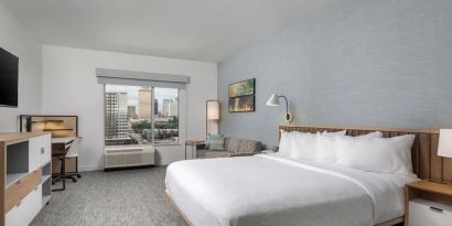 Day use room with work desk and sofa at TownePlace Suites Nashville Midtown.
