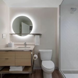 Guest bathroom with shower at TownePlace Suites Nashville Midtown.