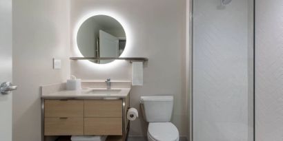 Guest bathroom with shower at TownePlace Suites Nashville Midtown.