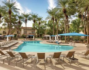 Stunning outdoor pool with sun beds at Hilton Scottsdale Resort & Villas.