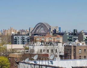 Rooftop terrace with city view at Astoria Inn LaGuardia Hotel.