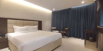 Romantic delux king room at Mayur Belgaum Presidency Hotel & Spa.