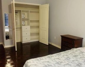 King bed with closet space at Home Stay Canada.