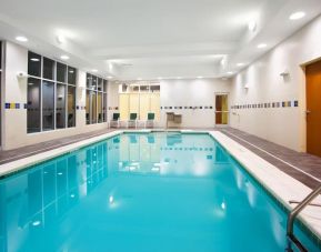 Relaxing indoor pool with seating area at Holiday Inn Aurora North- Naperville.