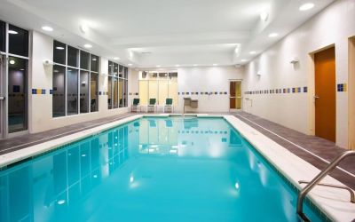 Relaxing indoor pool with seating area at Holiday Inn Aurora North- Naperville.