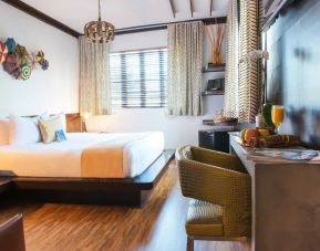 Cozy king bed with work space at Hotel Chelsea, A South Beach Group Hotel.