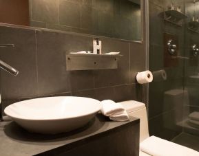 Guest bathroom with shower at Hotel Chelsea, A South Beach Group Hotel.