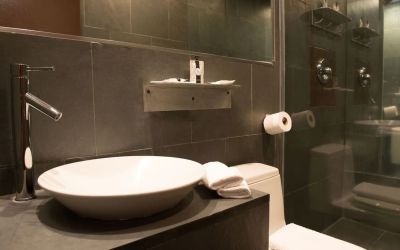 Guest bathroom with shower at Hotel Chelsea, A South Beach Group Hotel.