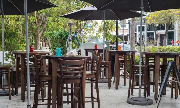 Hotel terrace with seating area at Hotel Chelsea, A South Beach Group Hotel.