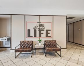 Lobby and coworking space at OYO Townhouse Orlando West.