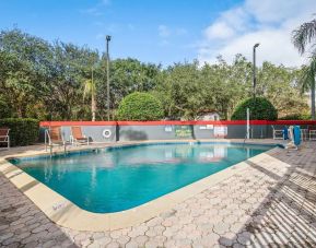 Relaxing outdoor pool at OYO Townhouse Orlando West.