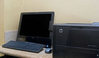 Business center with computer and printer at Travelodge LAX By Wyndham.
