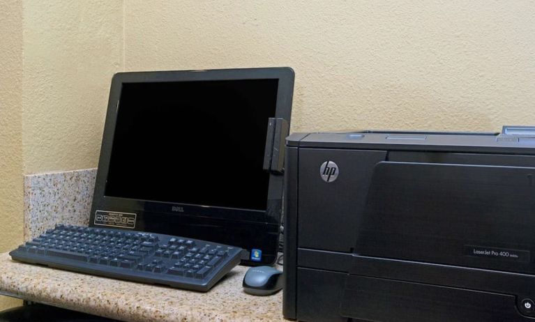 Business center with computer and printer at Travelodge LAX By Wyndham.